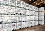 Stacked rows of IBC containers in a warehouse, organized for industrial storage and efficient space utilization.
