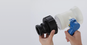 The image shows two parts of a plastic device being connected together with a blue tool for assembly.